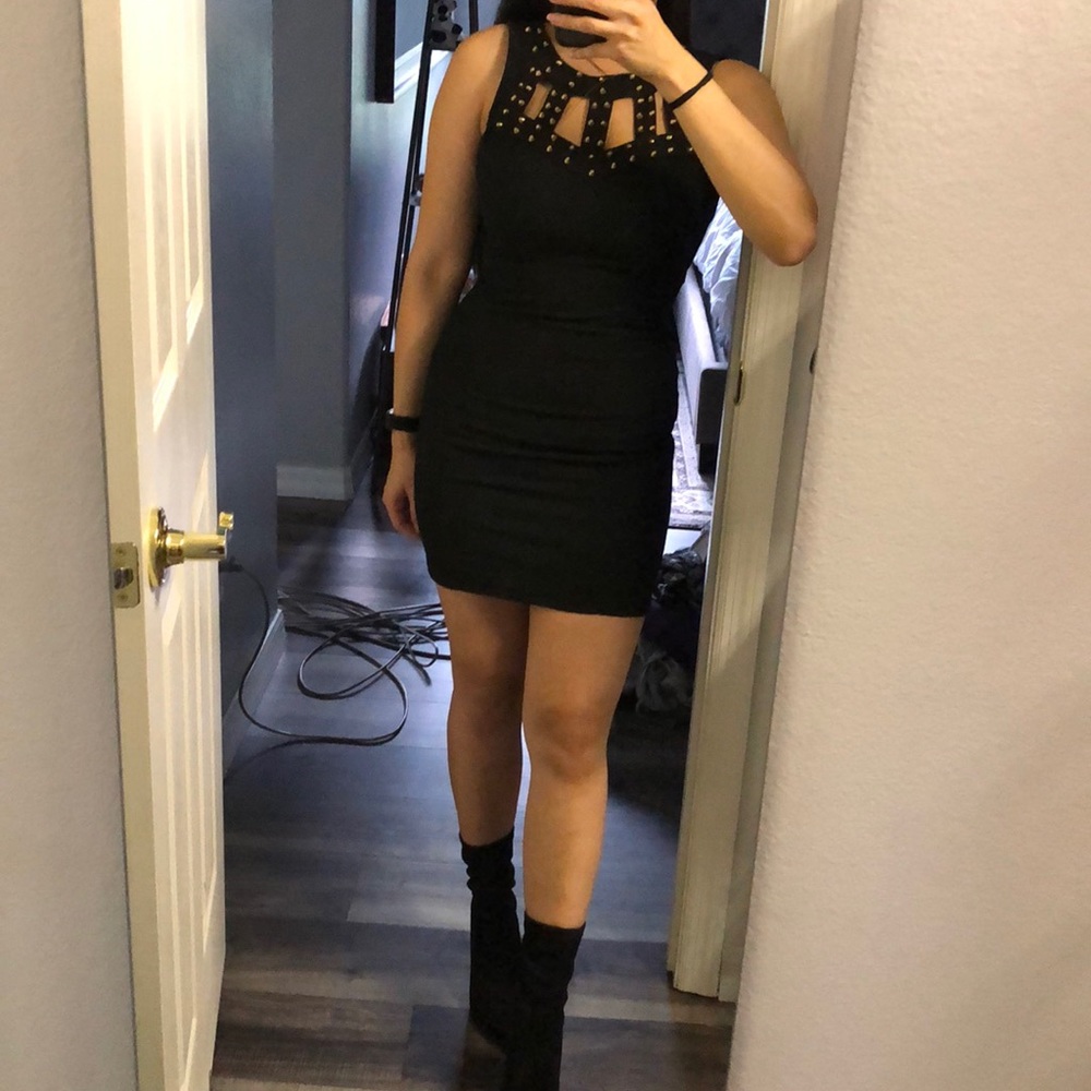 Black dress with gold stud detailing on chest